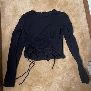 Black long sleeved shirt with strings